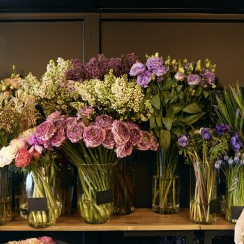 Various flowers kept on table at flower shop